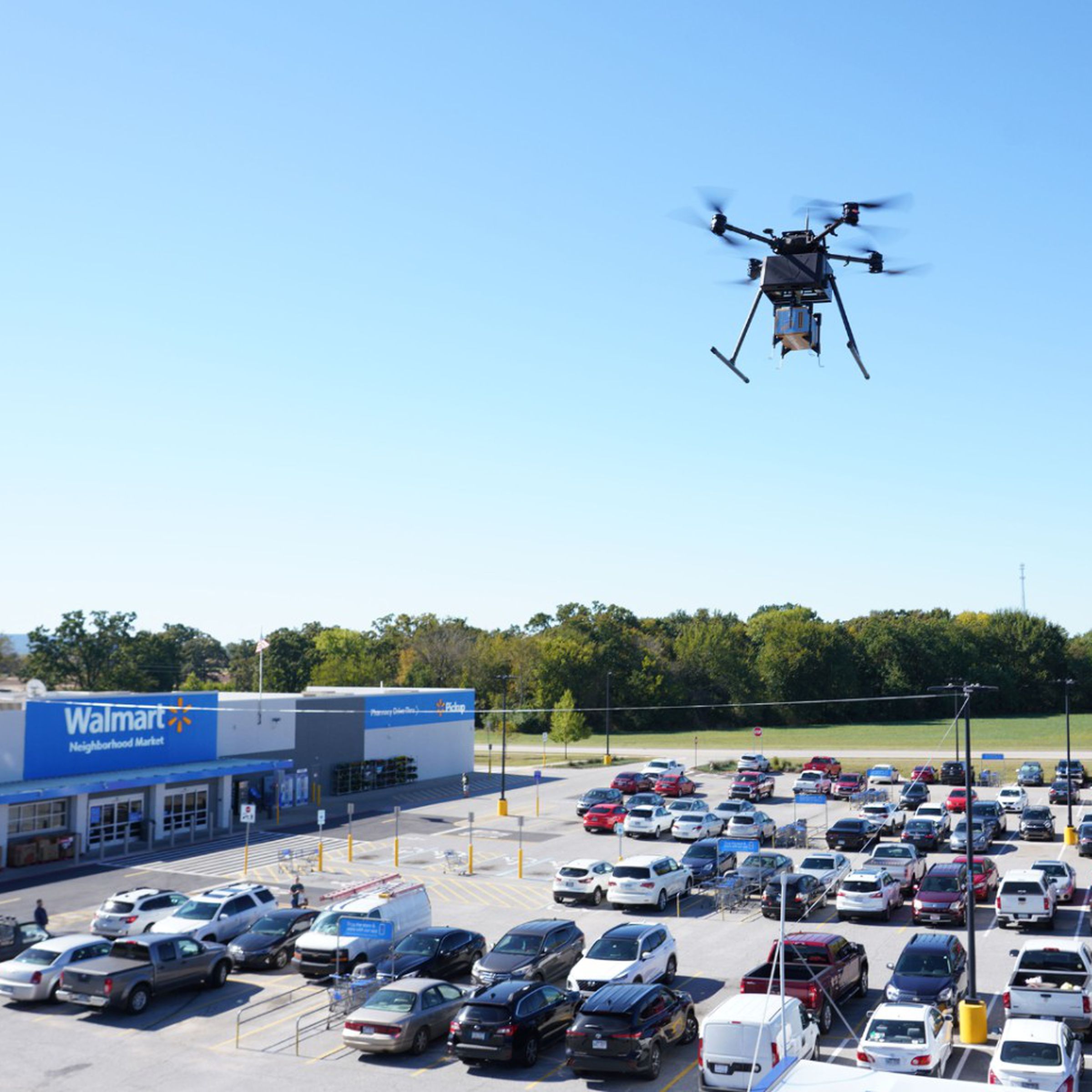 A DroneUp drone near a Walmart.