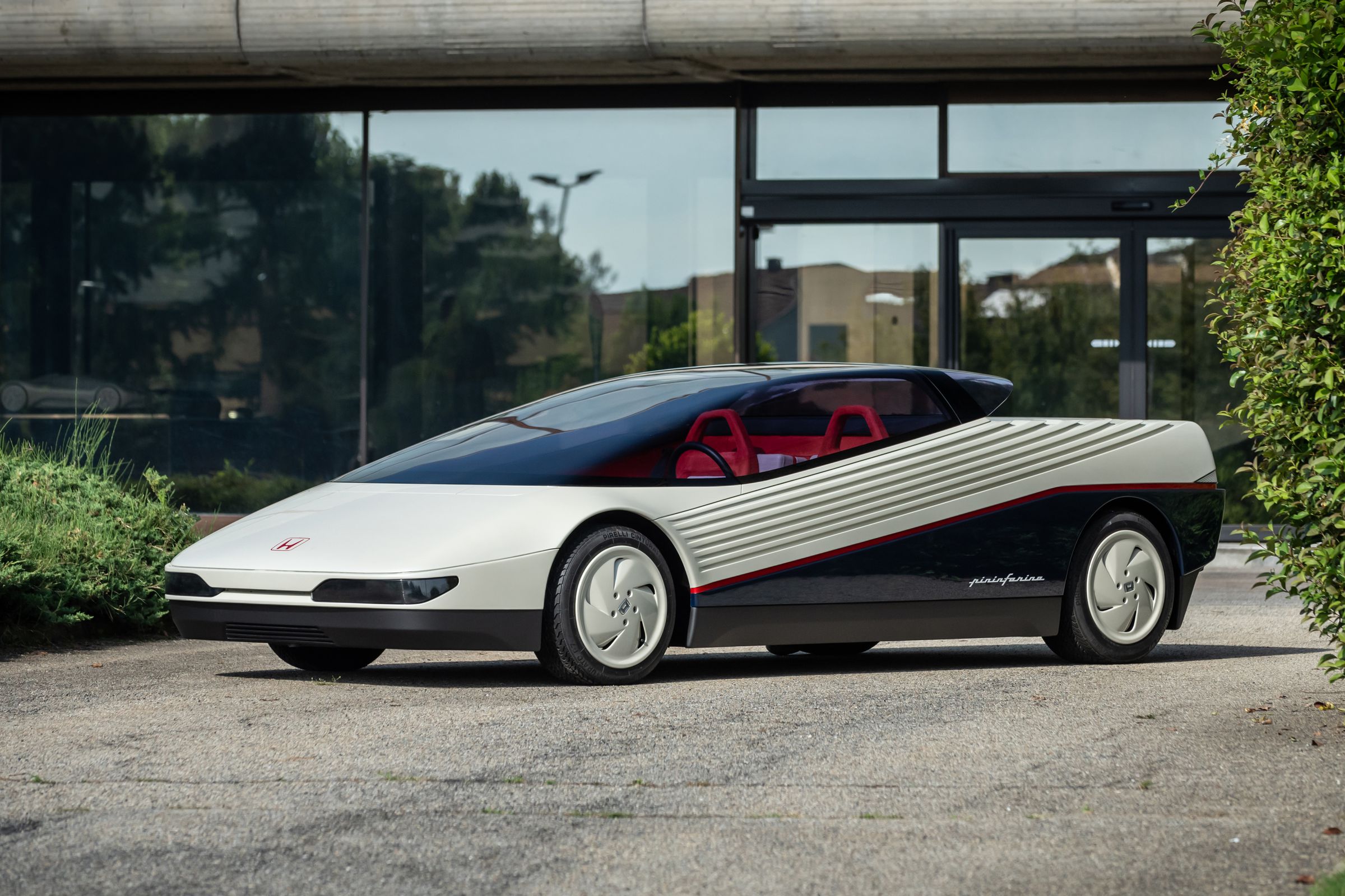 Wedge-shaped concept car photographed in front of a building