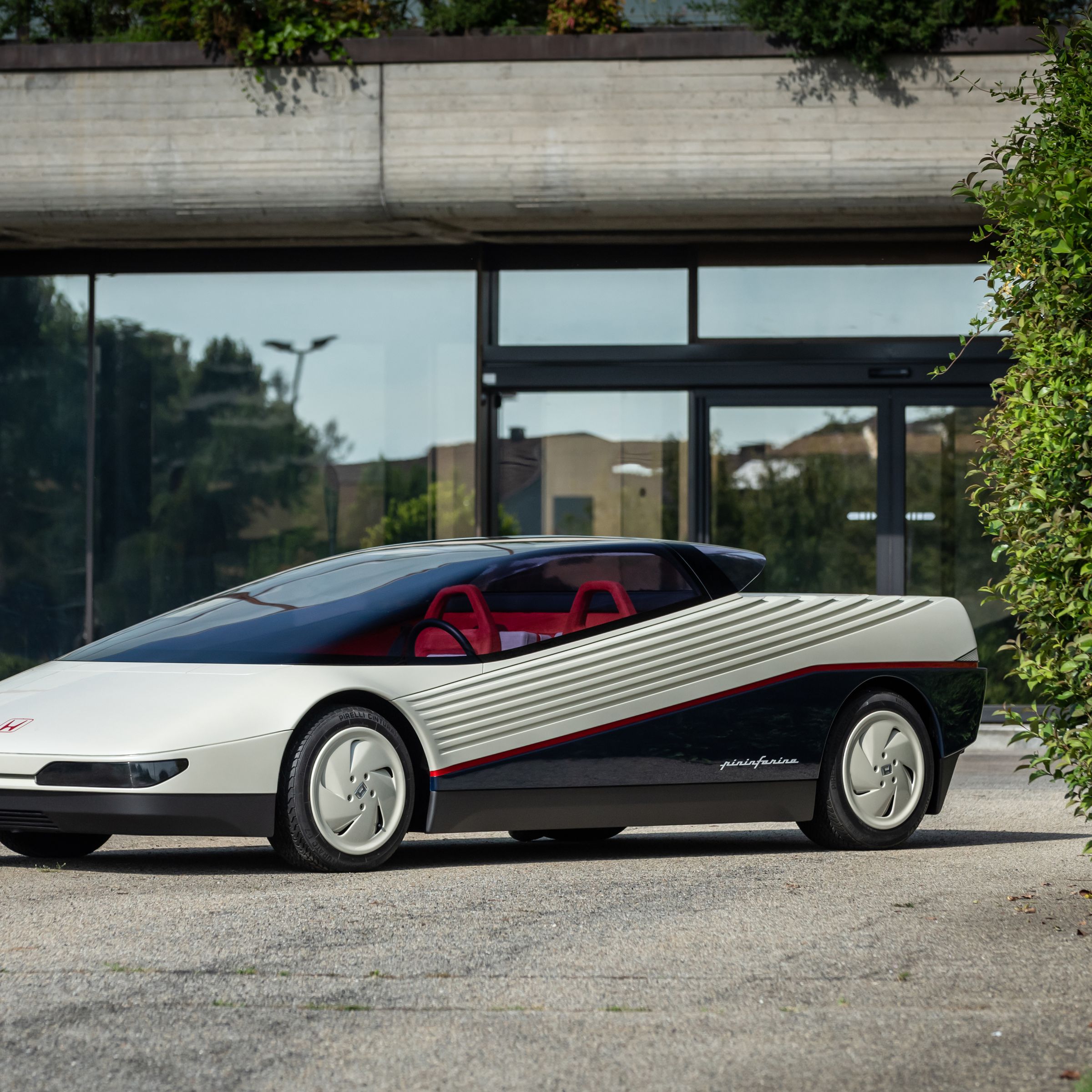 Wedge-shaped concept car photographed in front of a building