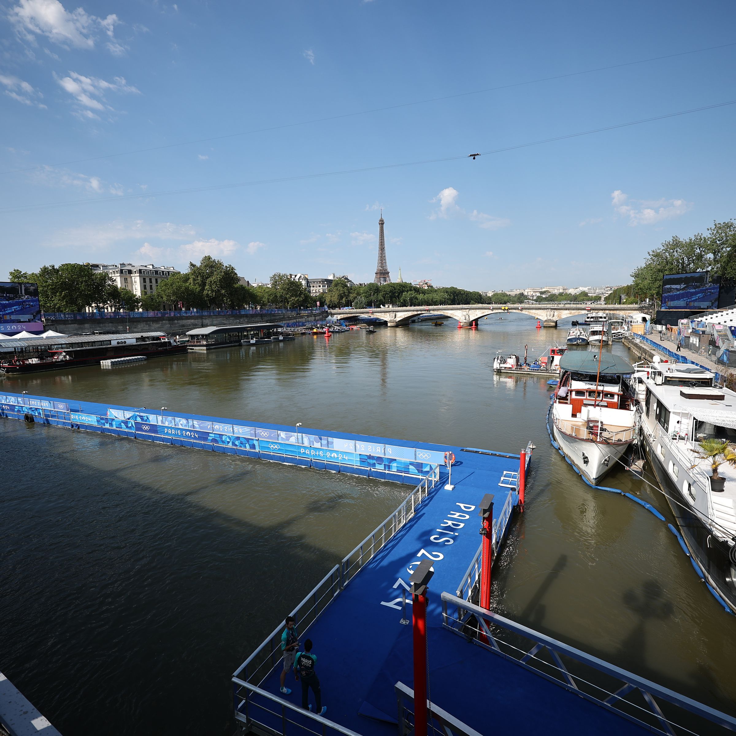 A view of the Seine with the Eiffel Tower in the background.