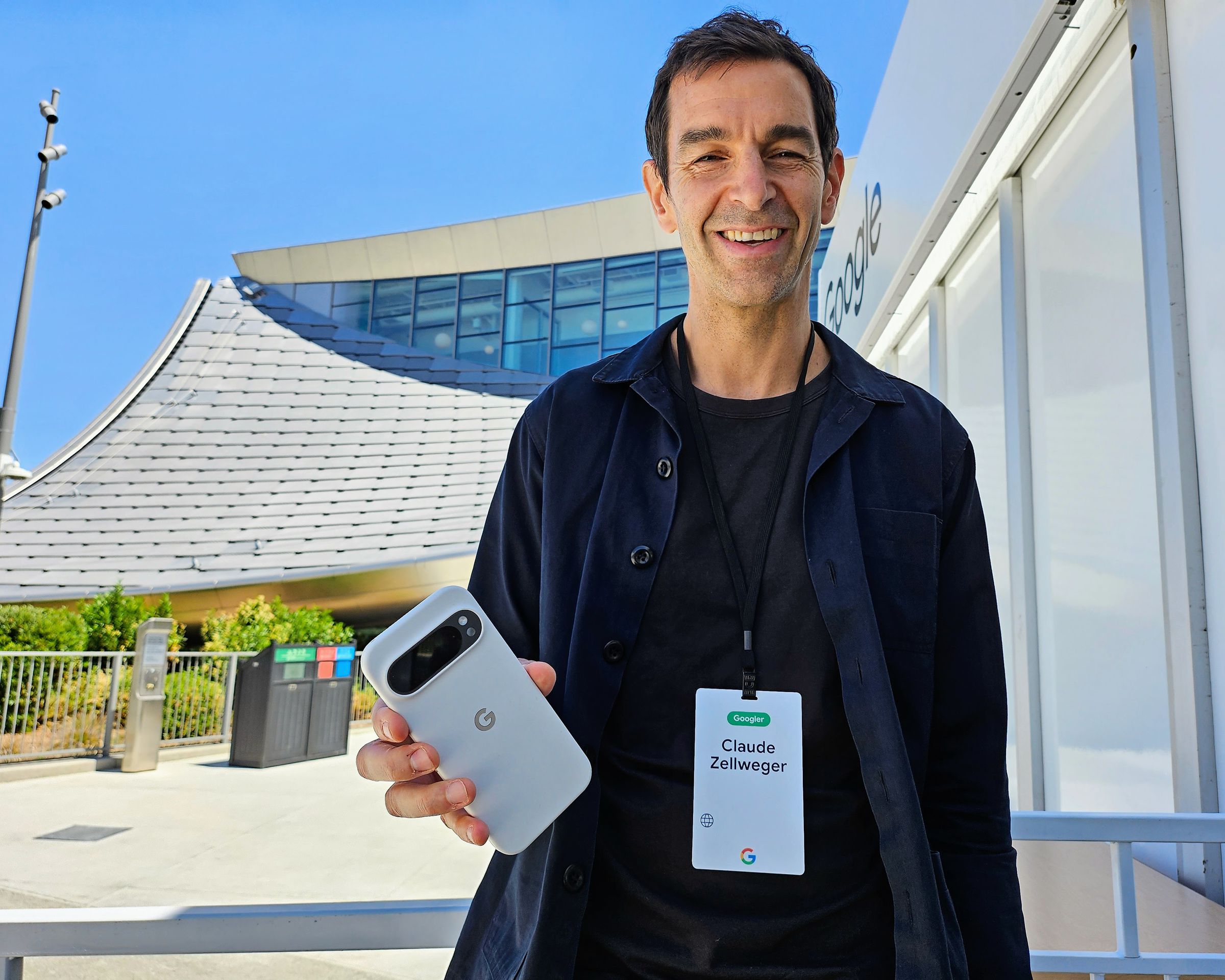 Google design director Claude Zellweger holds up a Pixel 9 series phone in a form-fitting case. “It’s the first time we’ve designed the phone and case hand in hand,” he says.