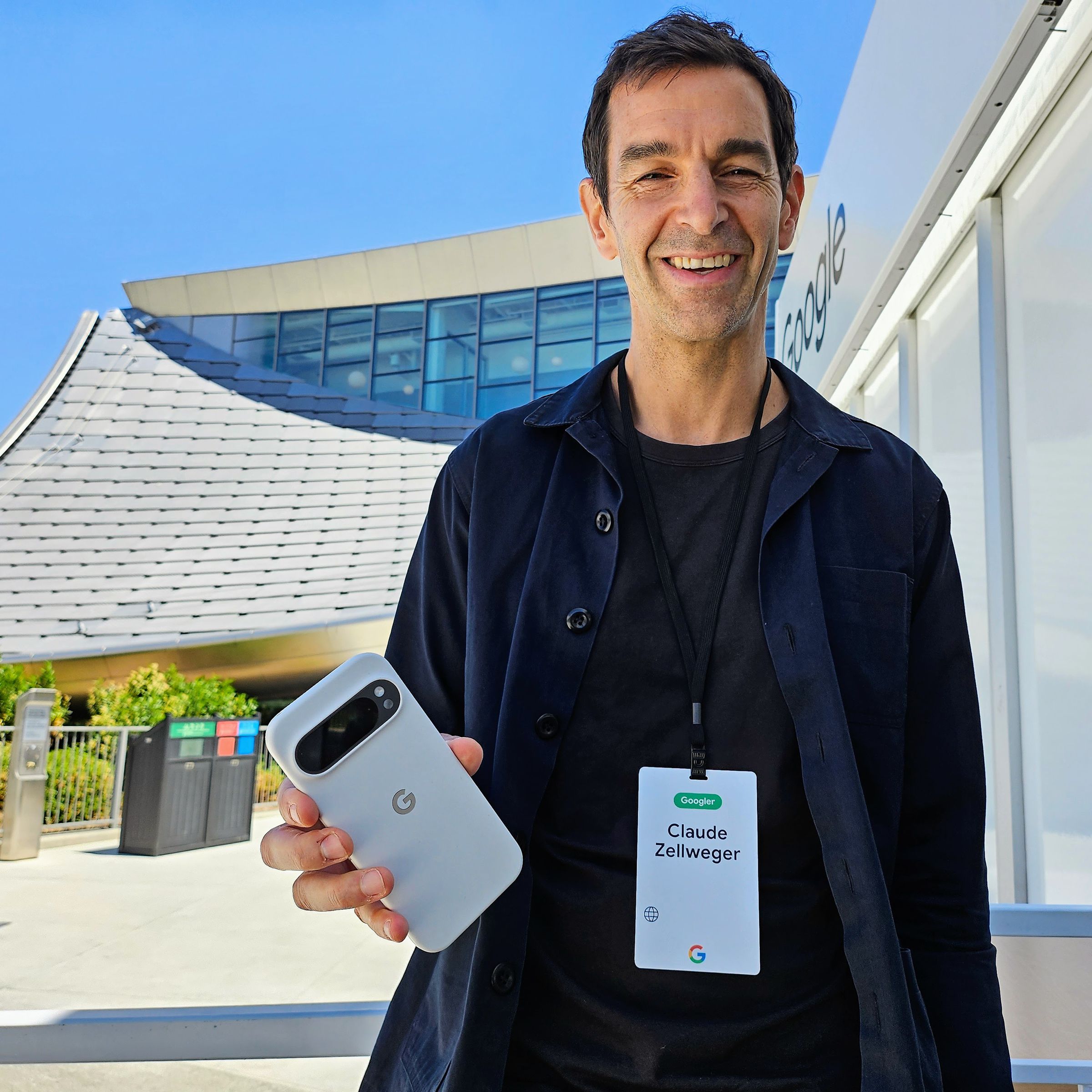 Google design director Claude Zellweger holds up a Pixel 9 series phone in a form-fitting case. “It’s the first time we’ve designed the phone and case hand in hand,” he says.