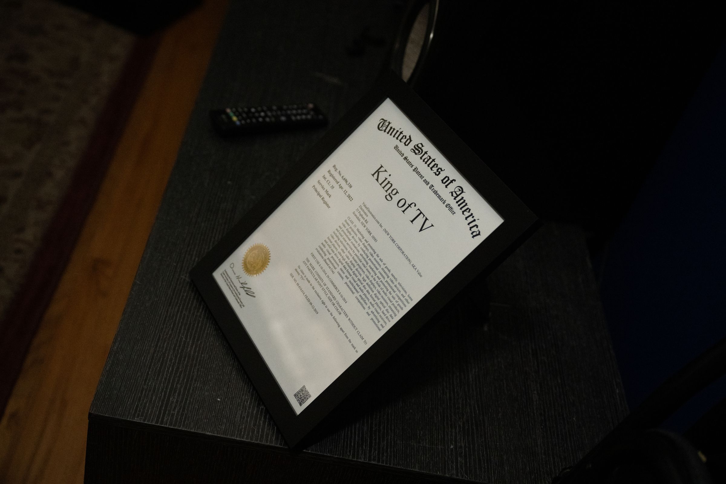 A United States Trademark Office certificate for the trademark “King of TV” in a frame