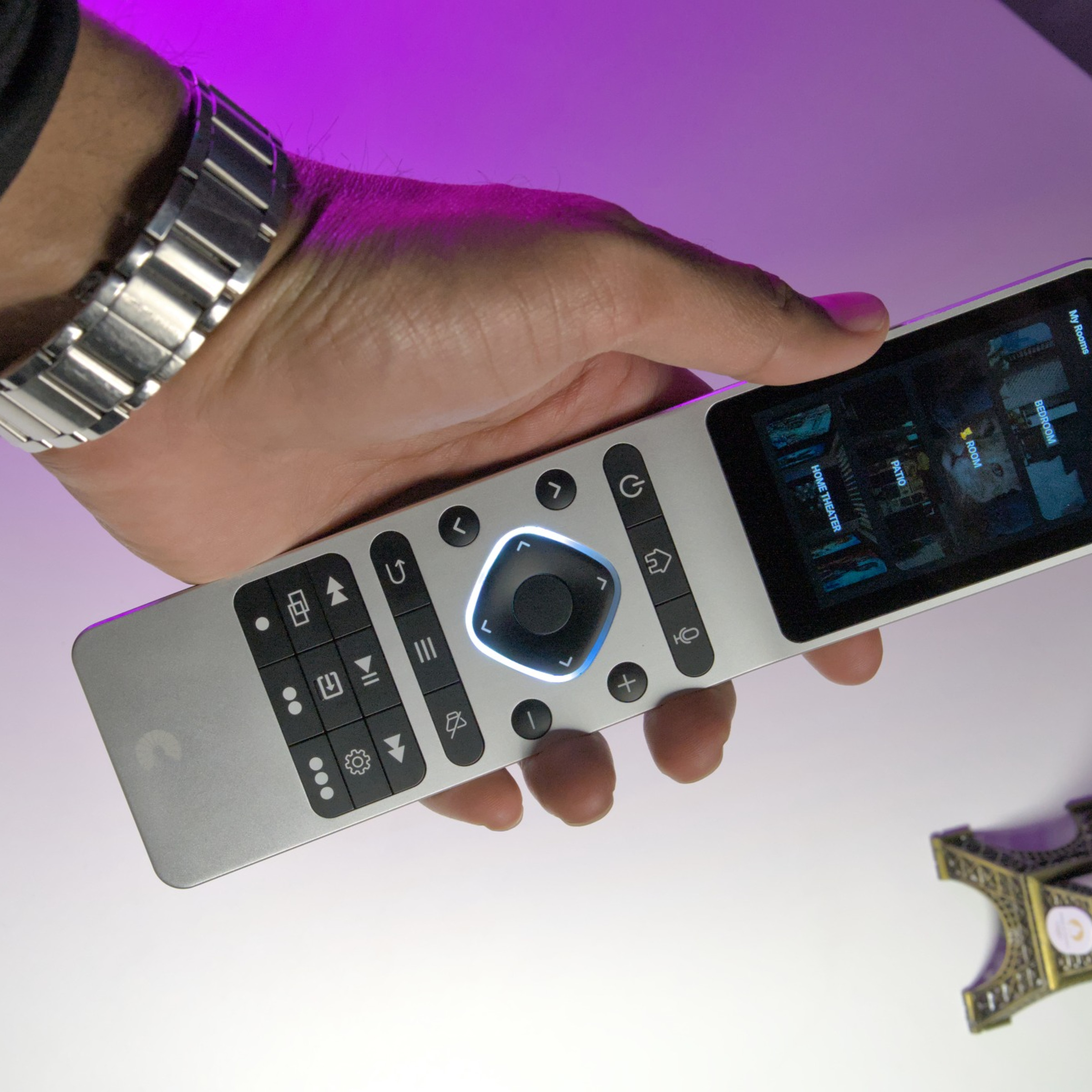 Someone holding Haptique RS90 remote