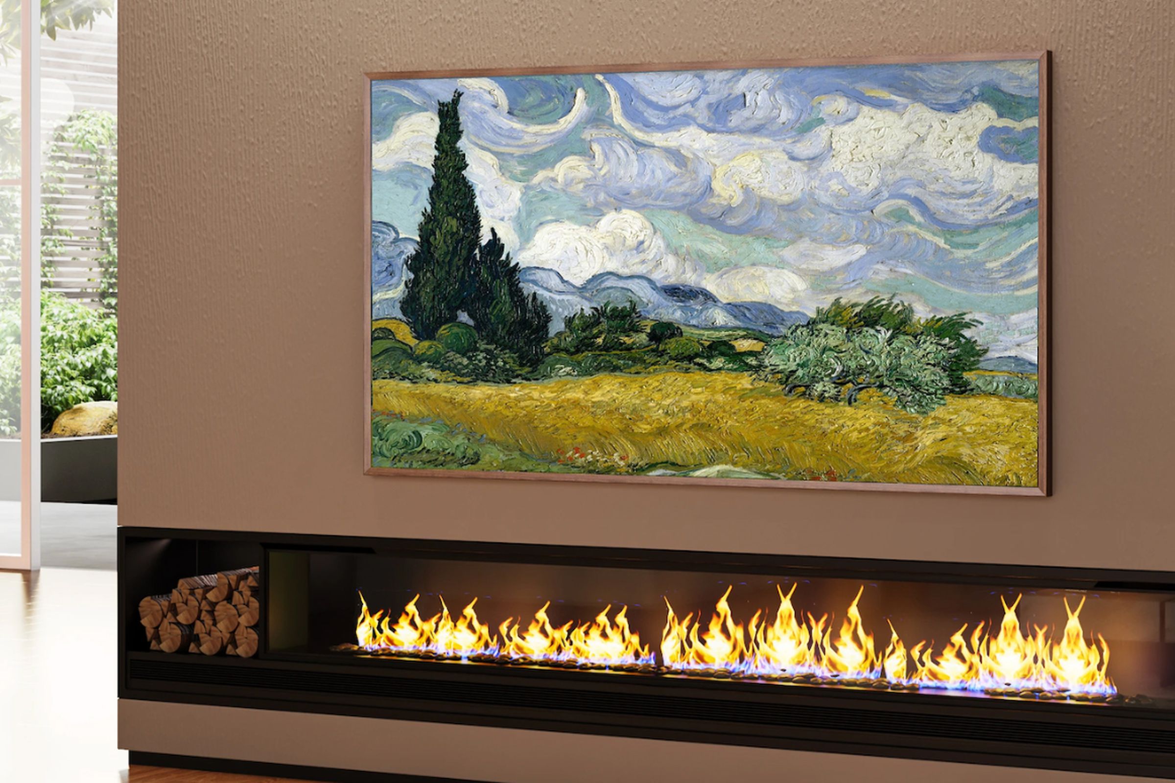 The Hisense CanvasTV displaying a landscape painting while hanging on a wall above a gas fireplace.