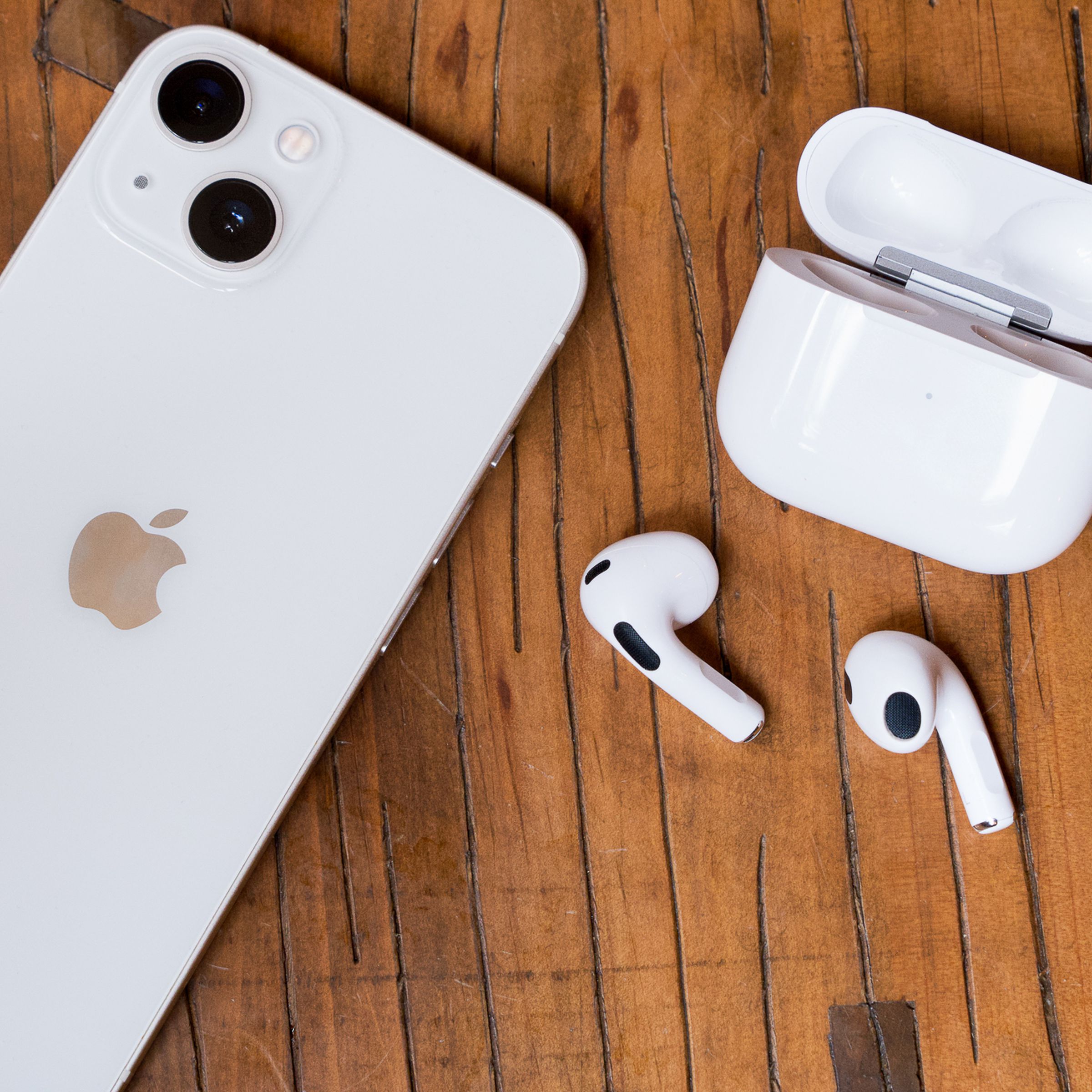 An iPhone and pair of third-gen AirPods.