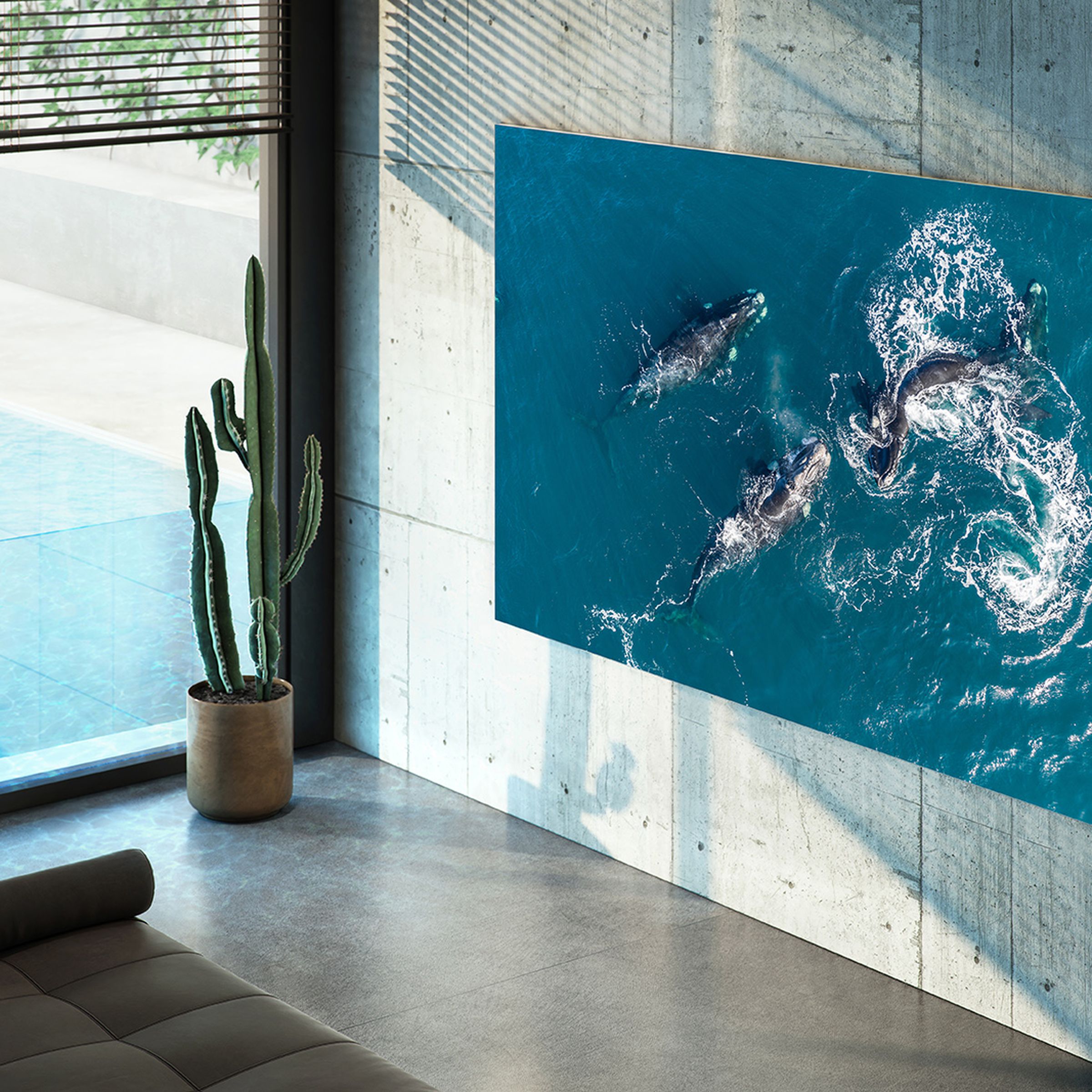 blue ocean wallpaper on a tv mounted on modern industrial tile home with ceiling to floor windows and lots of natural light.